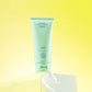 Get Fresh Calming Cleanser tube standing on a glass block against a yellow background, with a swirl of the cleanser on the block