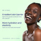 Smiling woman against a mint green background, beside the science: a resilient skin barrier, with eight times greater protection from free radicals, and more hydration and elasticity, twice as much when fermented